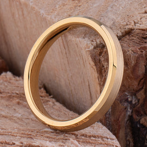 Yellow gold tungsten wedding ring with a brushed finish and polished beveled edges.