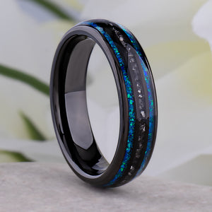 Black domed tungsten wedding ring with genuine meteorite center inlay and shimmering green-blue opal side inlays.