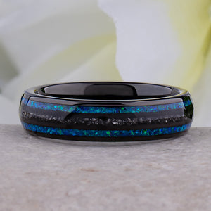 Black domed tungsten wedding ring with genuine meteorite center inlay and shimmering green-blue opal side inlays.